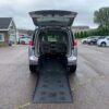 White Chrysler Voyager with Freedom Motors Rear Entry Manual Fold Out conversion