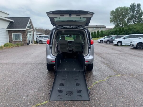 White Chrysler Voyager with Freedom Motors Rear Entry Manual Fold Out conversion