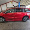 Red Honda Odyssey with BraunAbility Side Entry Automatic In Floor conversion