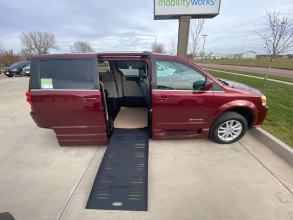 Red Dodge Grand Caravan with BraunAbility Side Entry Automatic Fold Out conversion