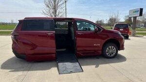 Red Toyota Sienna with BraunAbility Side Entry Automatic Fold Out conversion