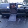 Black Dodge Grand Caravan with BraunAbility Side Entry Automatic Fold Out conversion