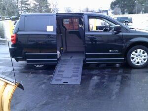 Black Dodge Grand Caravan with BraunAbility Side Entry Automatic Fold Out conversion