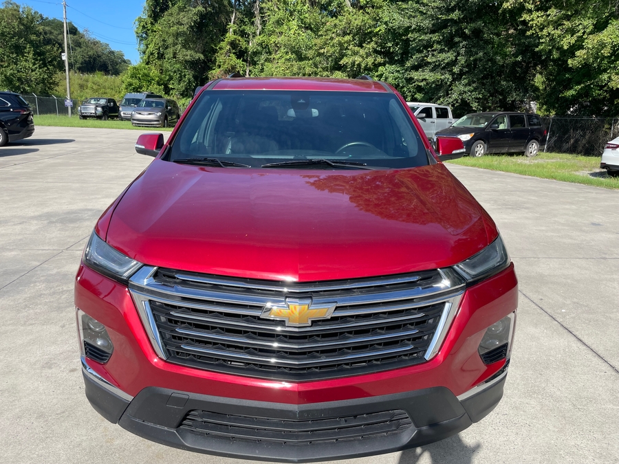 Red Chevrolet Traverse with BraunAbility Side Entry Automatic In Floor conversion