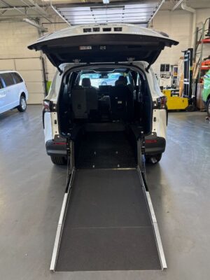 White Toyota Sienna with Driverge Rear Entry Manual Fold Out conversion
