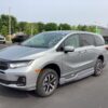 Silver Honda Odyssey with BraunAbility Side Entry Automatic In Floor conversion