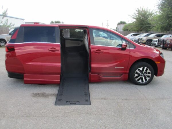 Red Honda Odyssey with BraunAbility Side Entry Automatic In Floor conversion