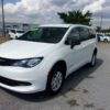 White Chrysler Voyager with BraunAbility Rear Entry Manual Fold Out conversion