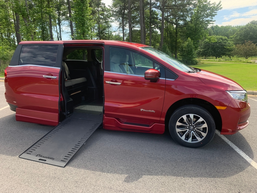 Red Honda Odyssey with BraunAbility Side Entry Automatic In Floor conversion