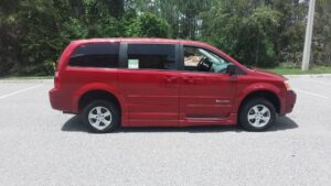 Red Dodge Grand Caravan with BraunAbility Side Entry Manual Fold Out conversion