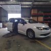 White Chrysler Voyager with Driverge Side Entry Automatic Fold Out conversion