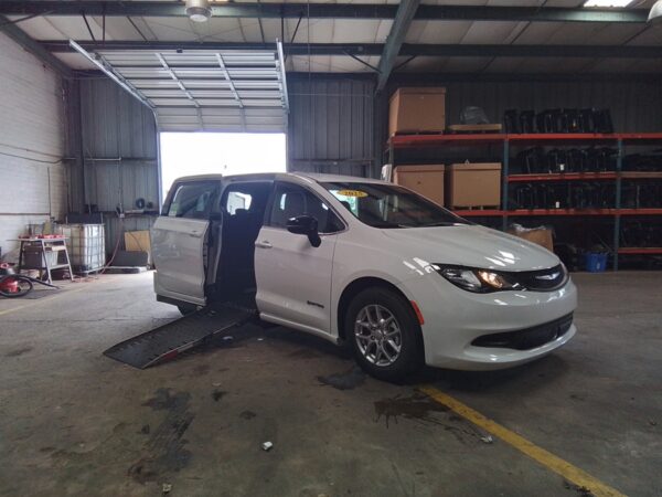 White Chrysler Voyager with Driverge Side Entry Automatic Fold Out conversion