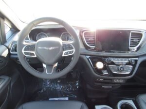 White Chrysler Pacifica with BraunAbility Side Entry Automatic Fold Out conversion