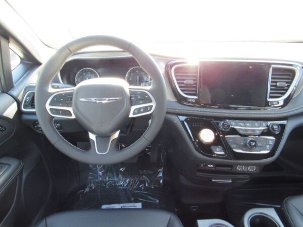 White Chrysler Pacifica with BraunAbility Side Entry Automatic Fold Out conversion