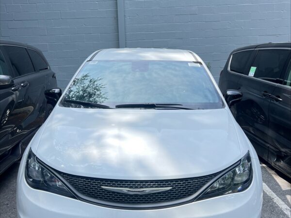 White Chrysler Voyager with Driverge Side Entry Automatic Fold Out conversion