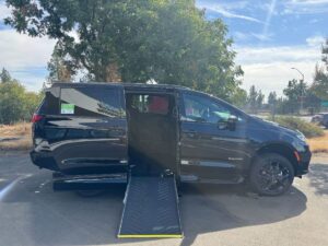 Black Chrysler Pacifica with Driverge Side Entry Automatic Fold Out conversion