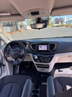 White Chrysler Voyager with Driverge Side Entry Automatic Fold Out conversion