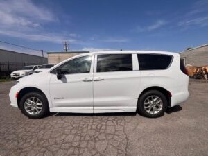 White Chrysler Pacifica with BraunAbility Side Entry Automatic Fold Out conversion