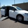 White Chrysler Voyager with Driverge Side Entry Automatic Fold Out conversion