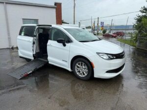 White Chrysler Voyager with Driverge Side Entry Automatic Fold Out conversion