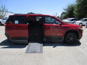 Red Chevrolet Traverse with BraunAbility Side Entry Automatic In Floor conversion