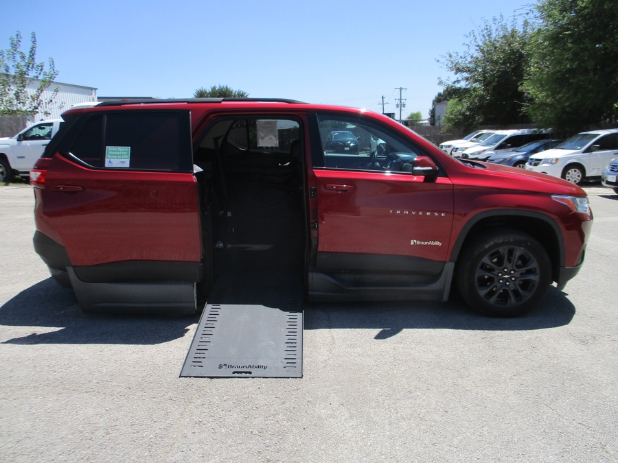 Red Chevrolet Traverse with BraunAbility Side Entry Automatic In Floor conversion
