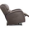 The EZ Sleeper with Twilight Lift Chair in brown leather is displayed fully reclined, featuring an extended footrest and a visible side pocket.