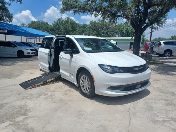 White Chrysler Voyager with Driverge Side Entry Automatic Fold Out conversion