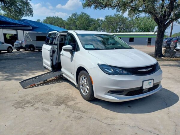 White Chrysler Voyager with Driverge Side Entry Automatic Fold Out conversion