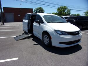 White Chrysler Voyager with Driverge Side Entry Automatic Fold Out conversion