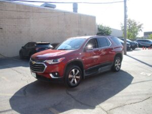 Red Chevrolet Traverse with BraunAbility Side Entry Automatic In Floor conversion