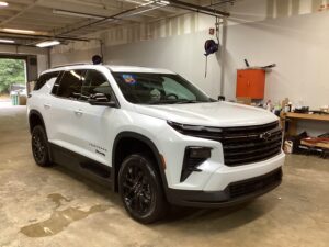White Chevrolet Traverse with BraunAbility Side Entry Automatic In Floor conversion