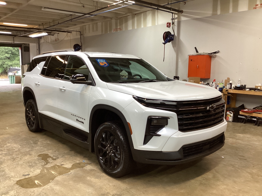 White Chevrolet Traverse with BraunAbility Side Entry Automatic In Floor conversion