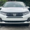 White Honda Odyssey with BraunAbility Side Entry Automatic In Floor conversion