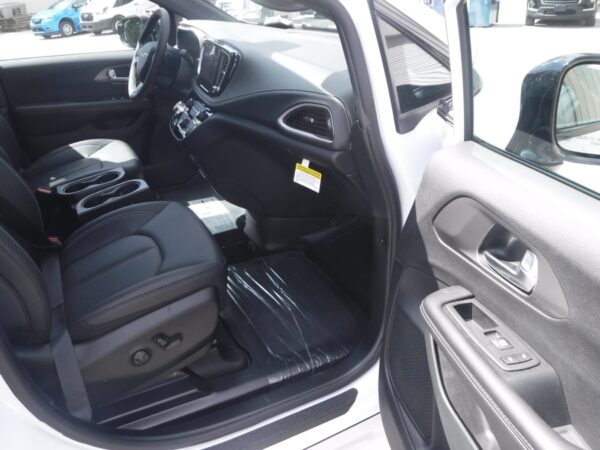 White Chrysler Pacifica with BraunAbility Side Entry Automatic In Floor conversion