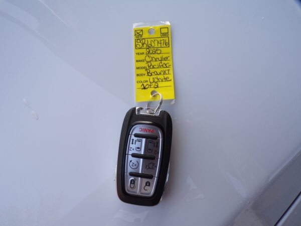 White Chrysler Pacifica with BraunAbility Side Entry Automatic Fold Out conversion