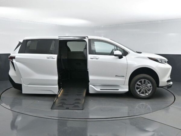 White Toyota Sienna with BraunAbility Side Entry Automatic Fold Out conversion