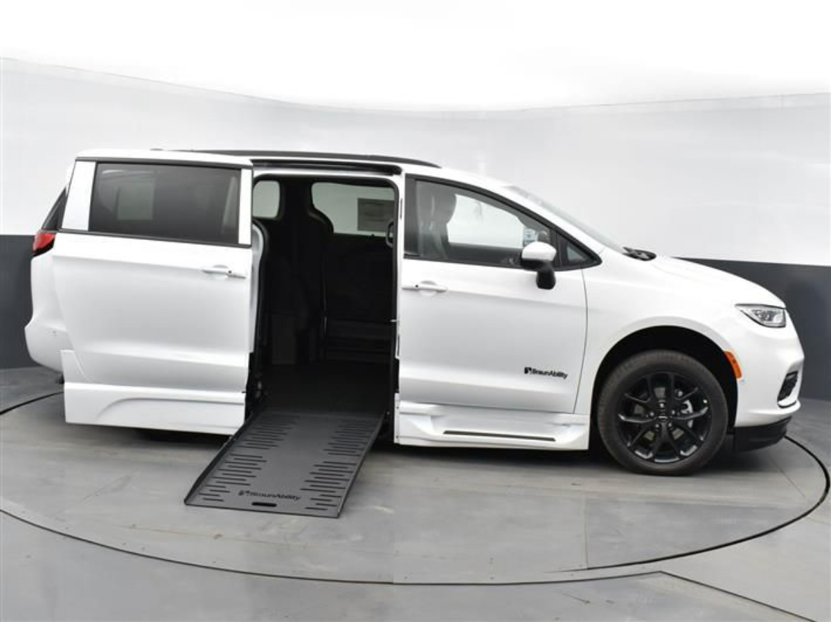 White Chrysler Pacifica with BraunAbility Side Entry Automatic Fold Out conversion