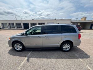 Silver Dodge Grand Caravan with Driverge Side Entry Automatic Fold Out conversion