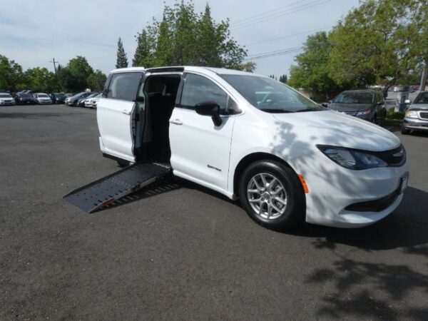 White Chrysler Voyager with Driverge Side Entry Automatic Fold Out conversion