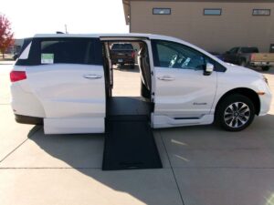 White Honda Odyssey with BraunAbility Side Entry Automatic In Floor conversion