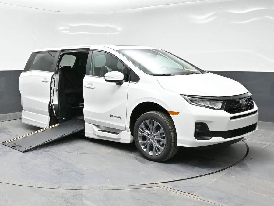 White Honda Odyssey with BraunAbility Side Entry Automatic In Floor conversion
