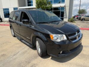 Black Dodge Grand Caravan with Driverge Side Entry Automatic Fold Out conversion