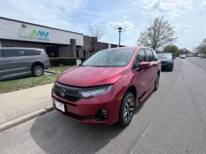 Red Honda Odyssey with BraunAbility Side Entry Automatic In Floor conversion