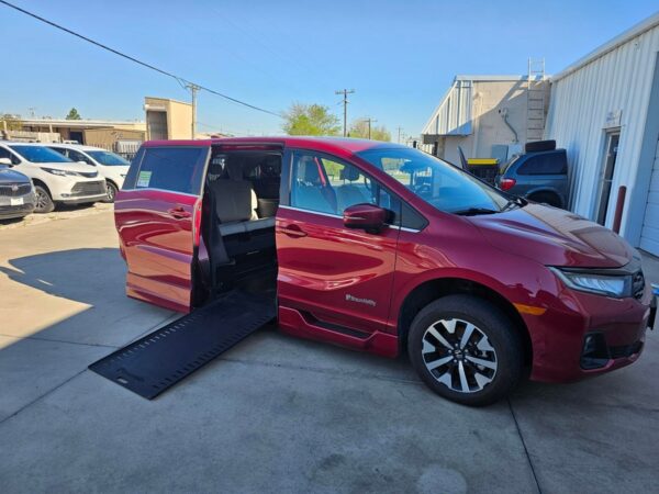 Red Honda Odyssey with BraunAbility Side Entry Automatic In Floor conversion