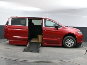 Red Chrysler Voyager with BraunAbility Side Entry Automatic Fold Out conversion