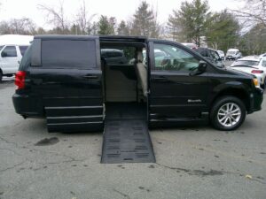 Black Dodge Grand Caravan with BraunAbility Side Entry Automatic Fold Out conversion