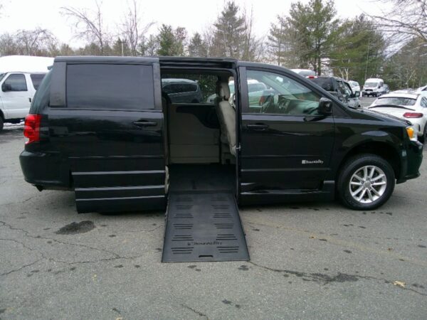 Black Dodge Grand Caravan with BraunAbility Side Entry Automatic Fold Out conversion