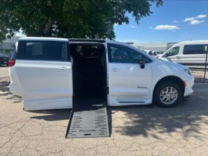 White Chrysler Voyager with BraunAbility Side Entry Automatic Fold Out conversion