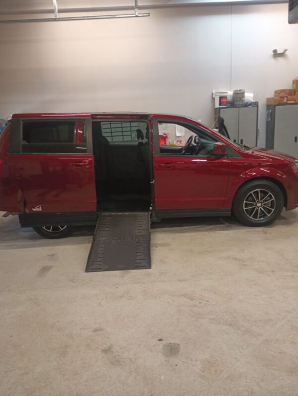 Red Dodge Grand Caravan with Vantage Mobility Side Entry Automatic Fold Out conversion